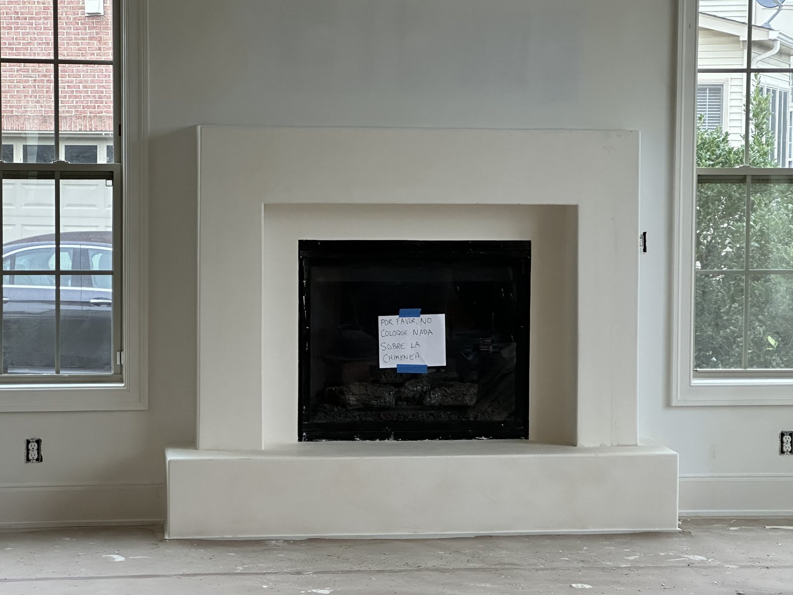 White Italian plaster fireplace surround