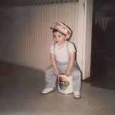 Ronald Layman as a young child dressed in painter's clothes